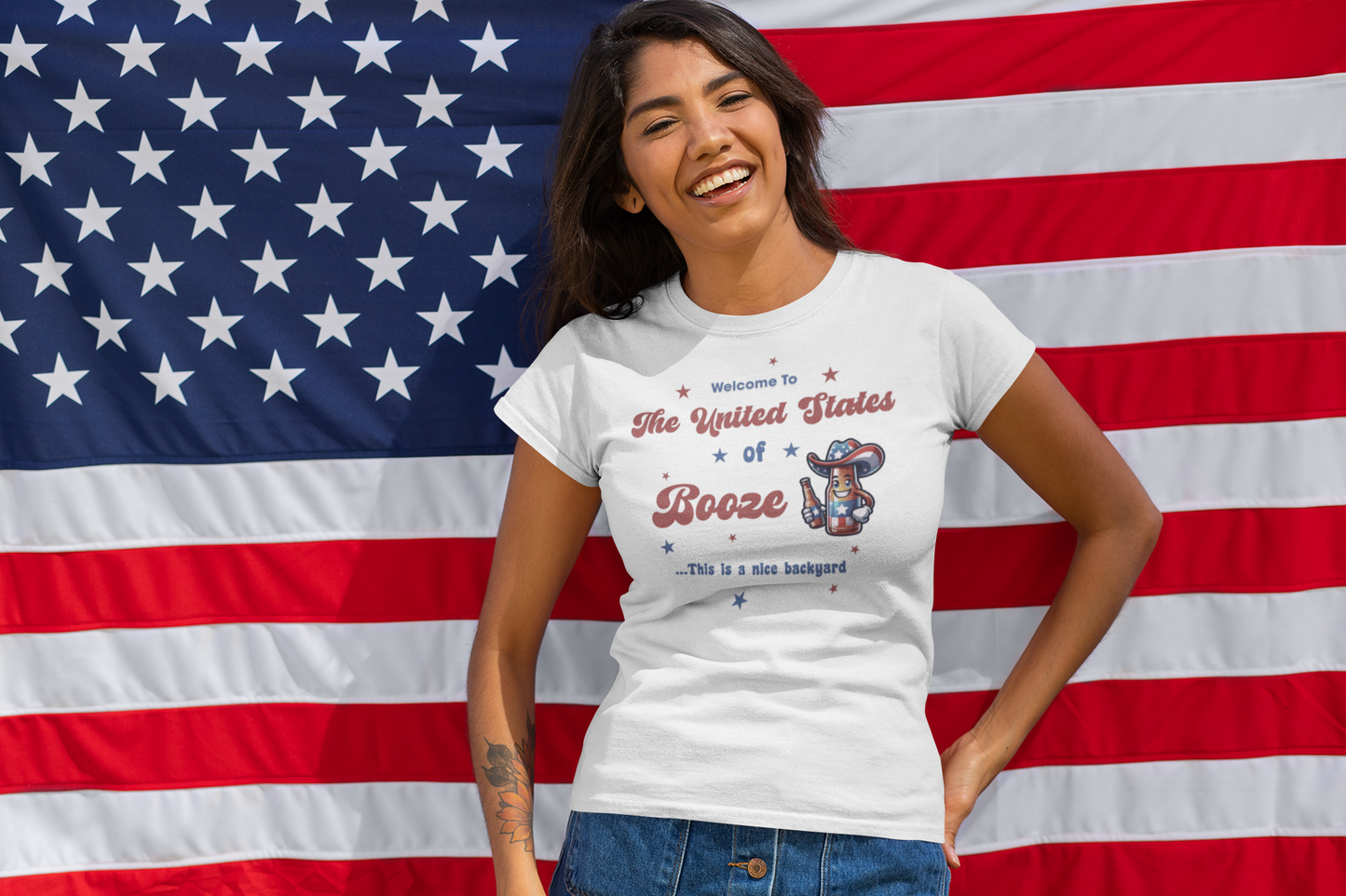 mockup-of-a-happy-woman-wearing-a-customizable-t-shirt-in-front-of-an-american-flag-33016.png