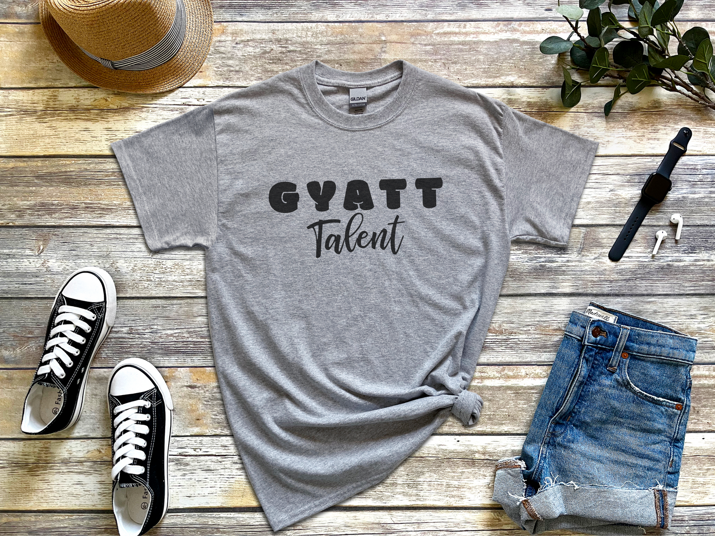 a t - shirt that says gyatt talent next to a pair of jeans