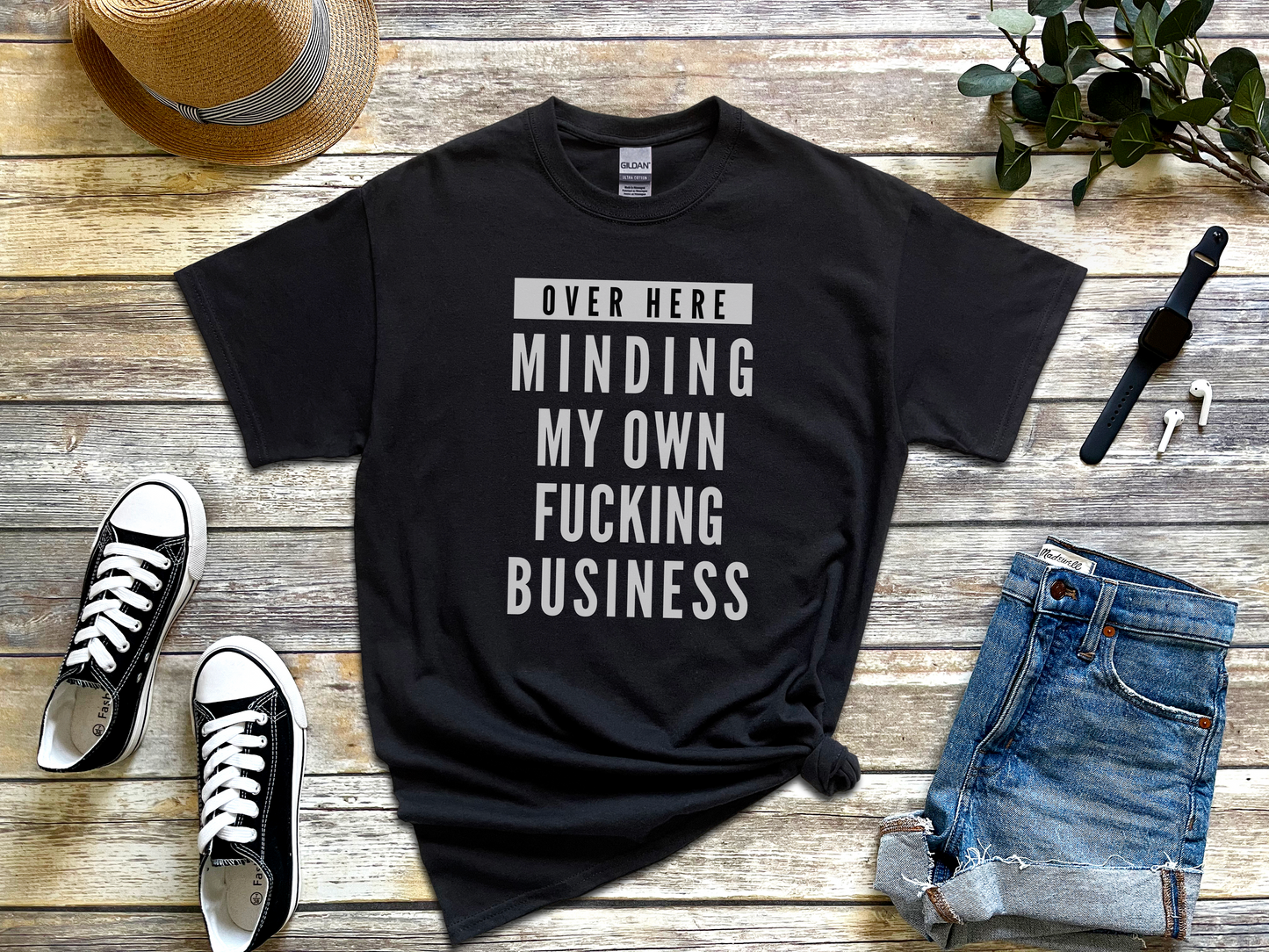 a t - shirt that says, over here, minding my own fucking business