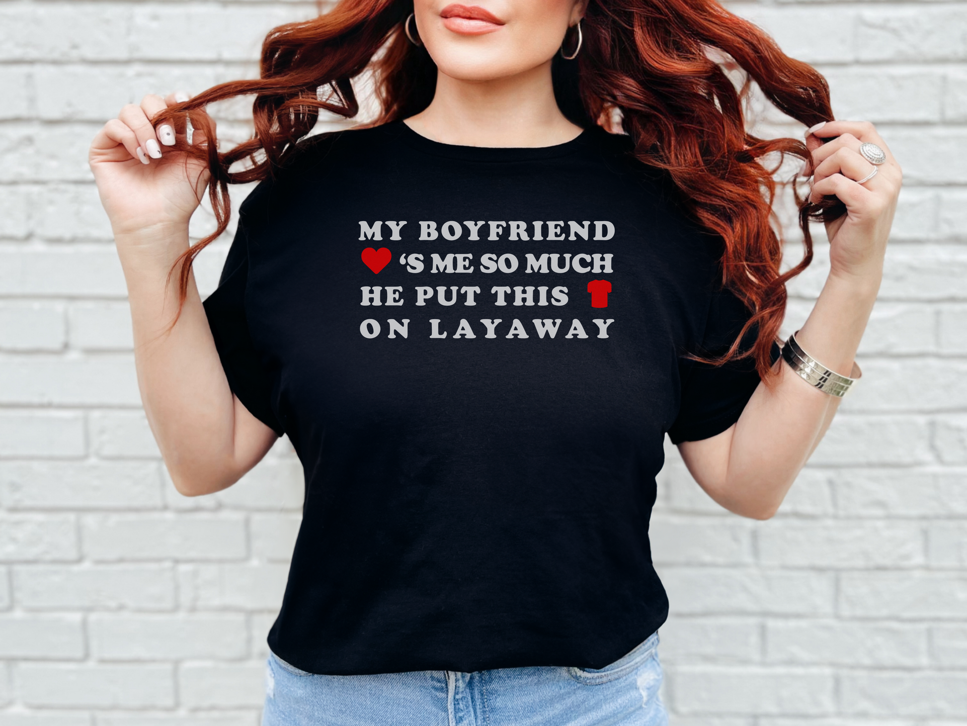 a woman wearing a t - shirt that says my boyfriend is so much he put