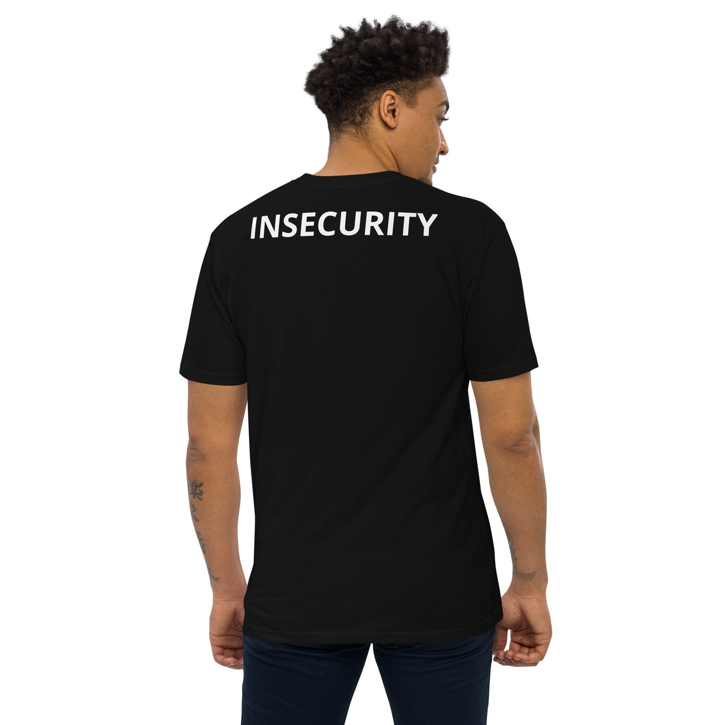 a man wearing a black t - shirt with the word insecity printed on