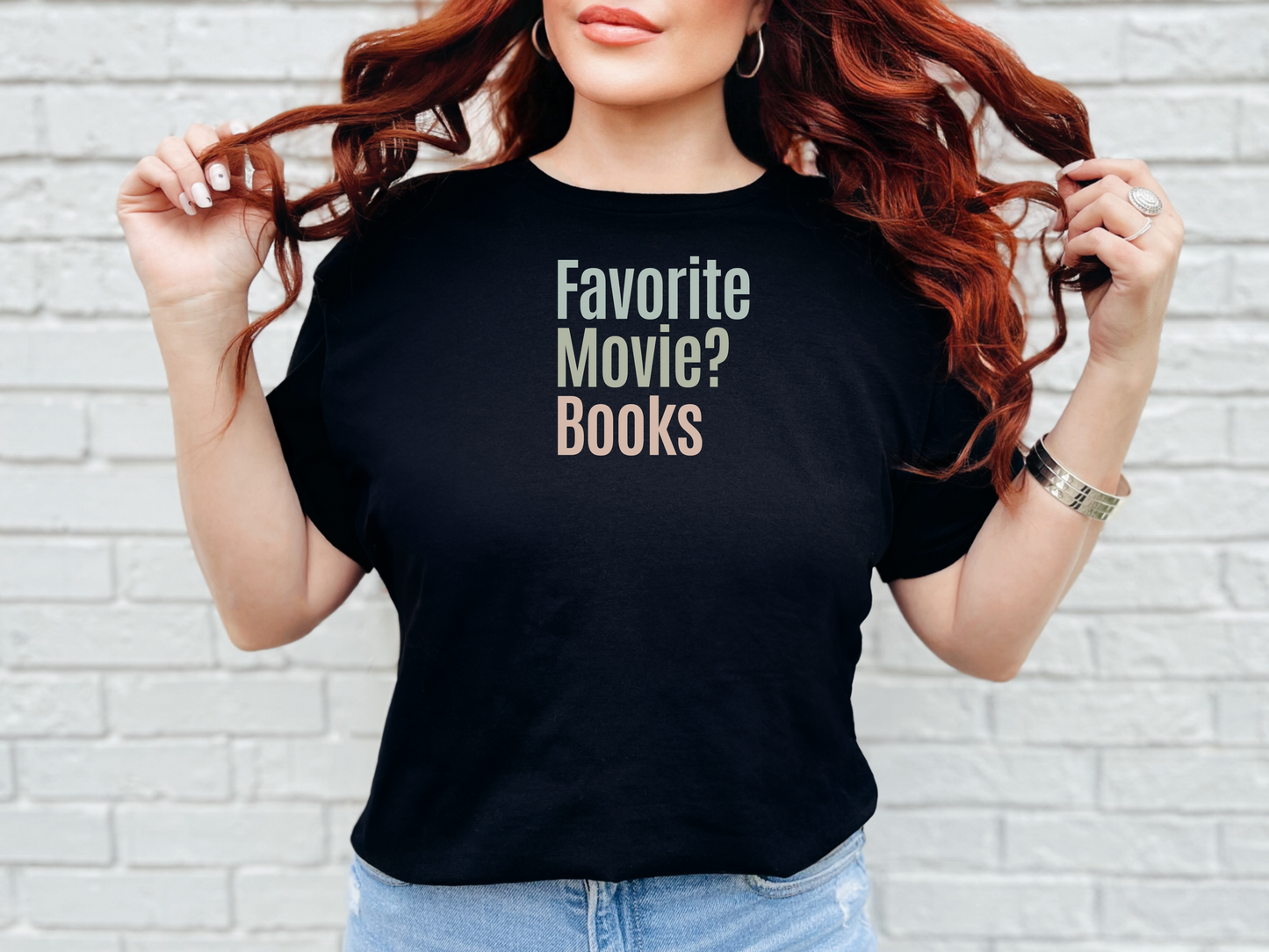 a woman with red hair wearing a black t - shirt that says favorite movie books