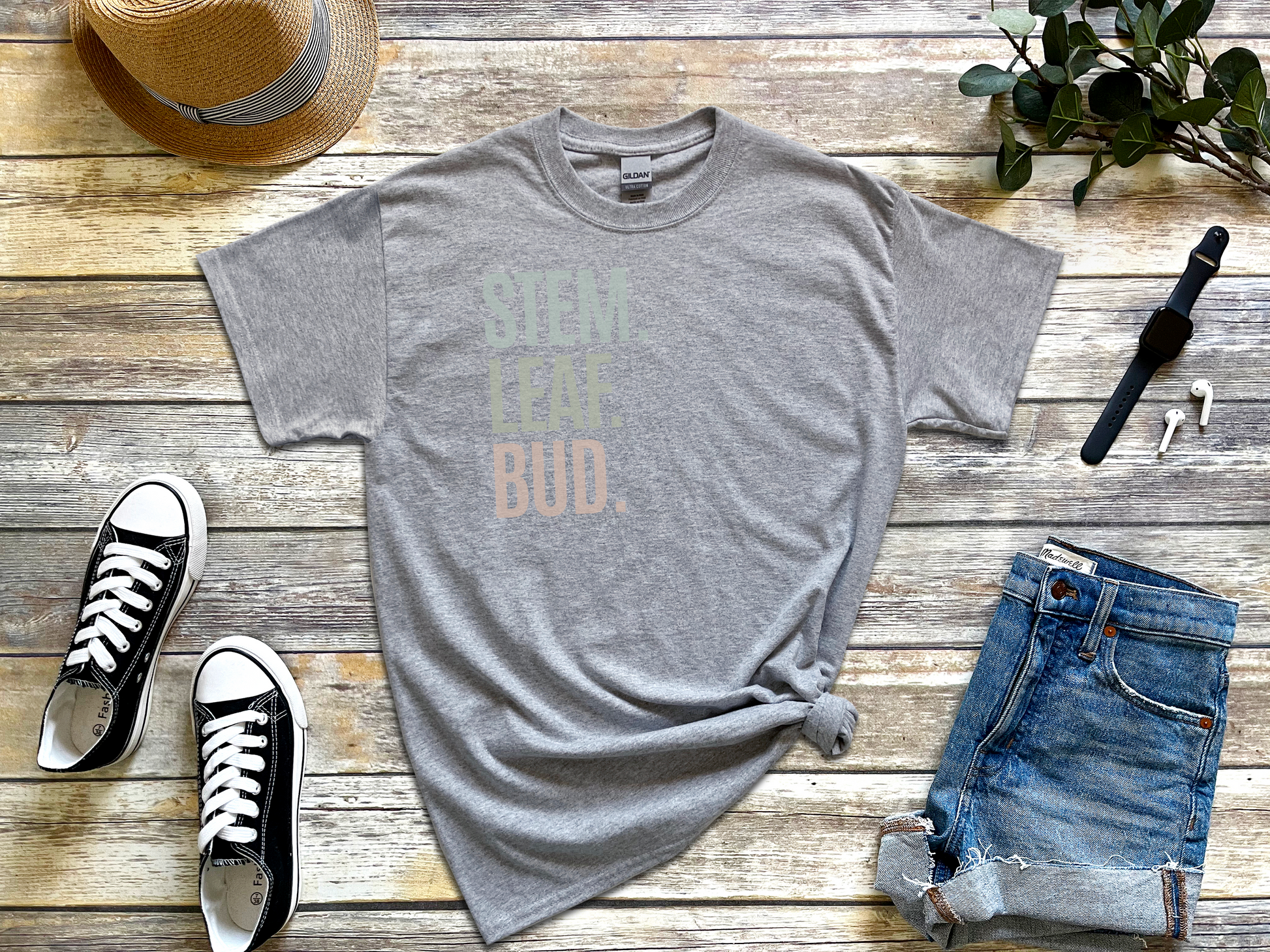 a t - shirt with the words free as a bud on it next to a