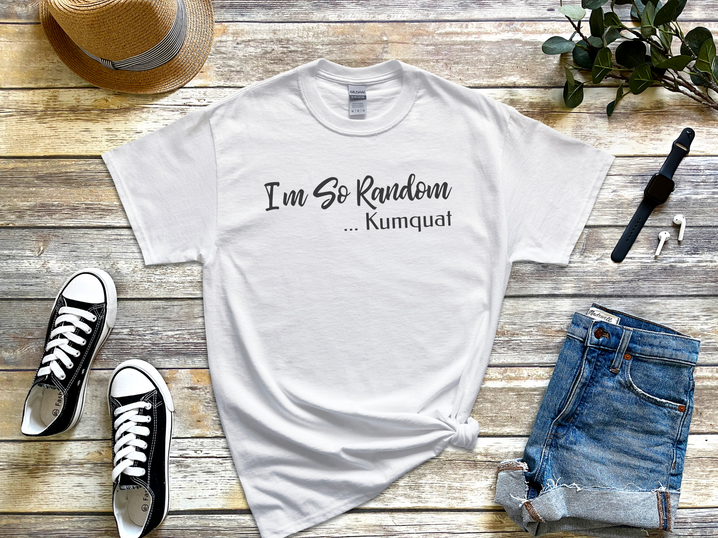 a white t - shirt with the words i'm so random and a pair