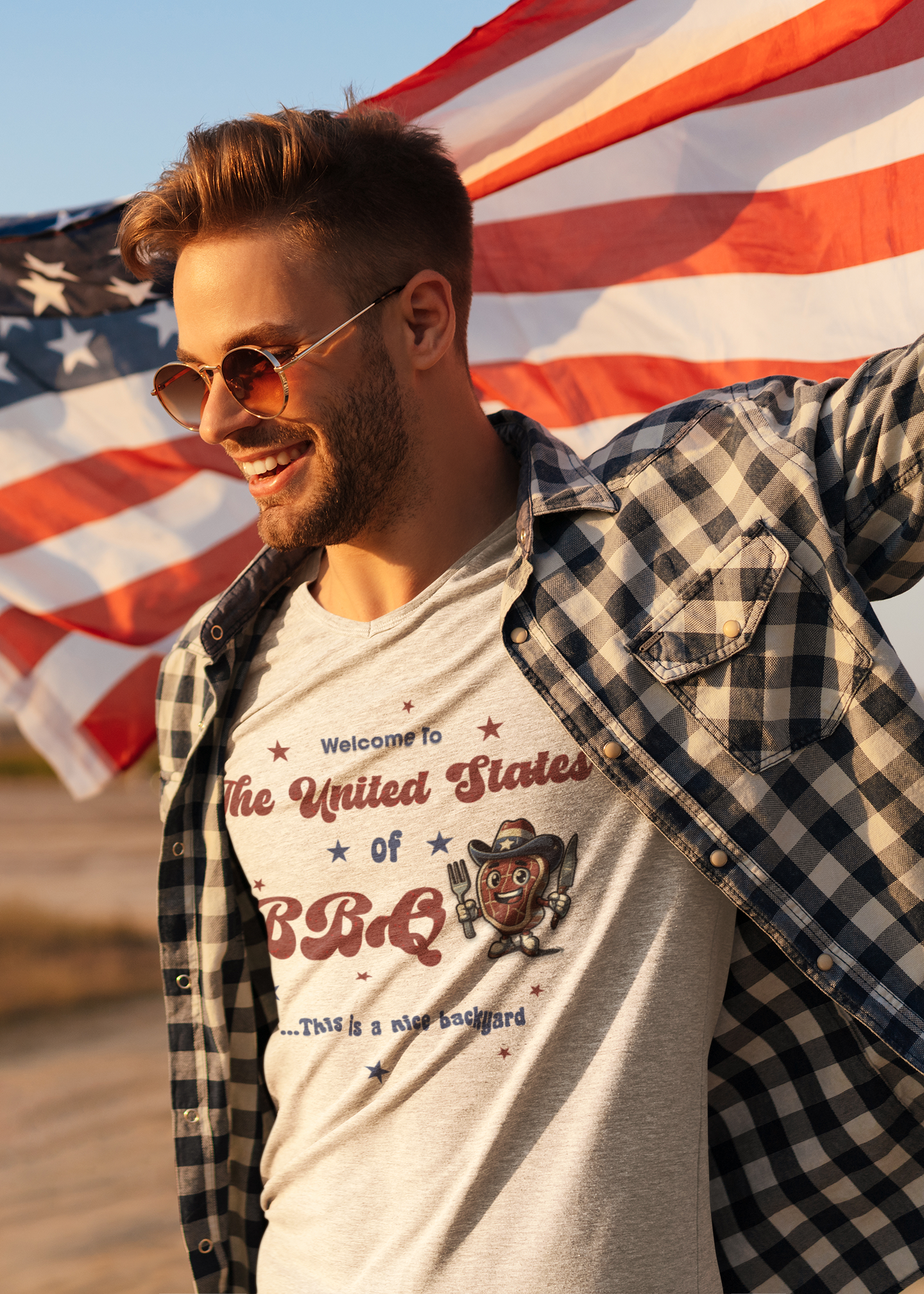 a man in a plaid shirt and sunglasses holding an american flag