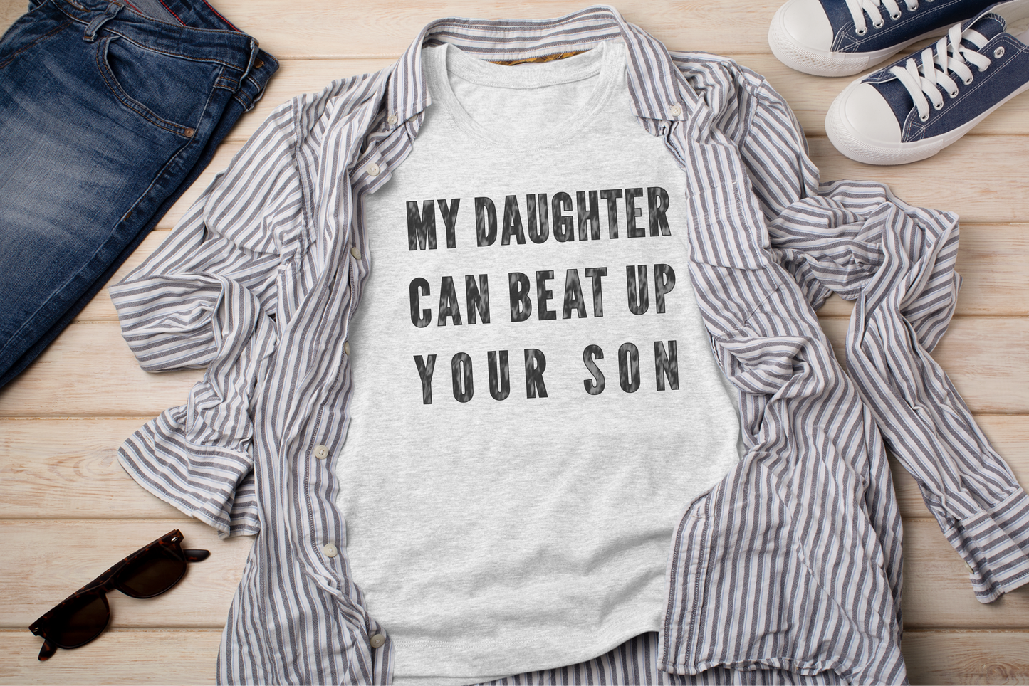 a shirt that says, my daughter can beat up your son