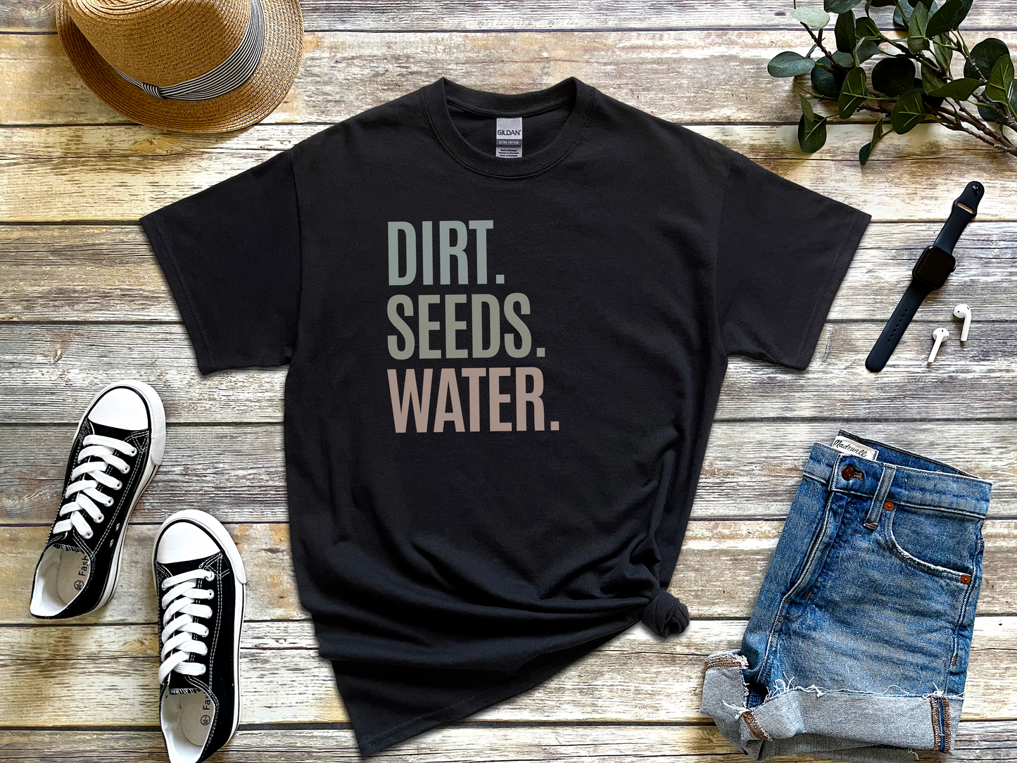 a black shirt that says dirt seeds water