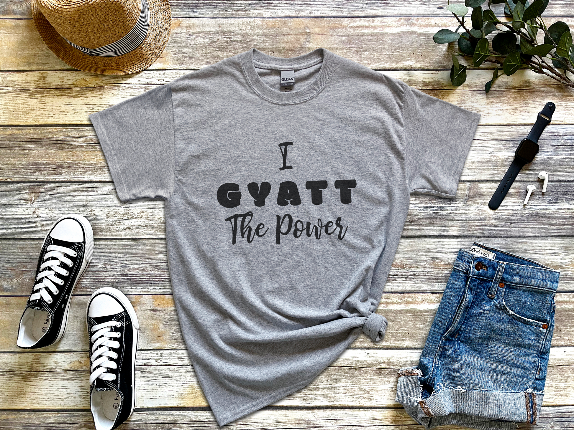 a t - shirt that says i gyatt the power on it next to