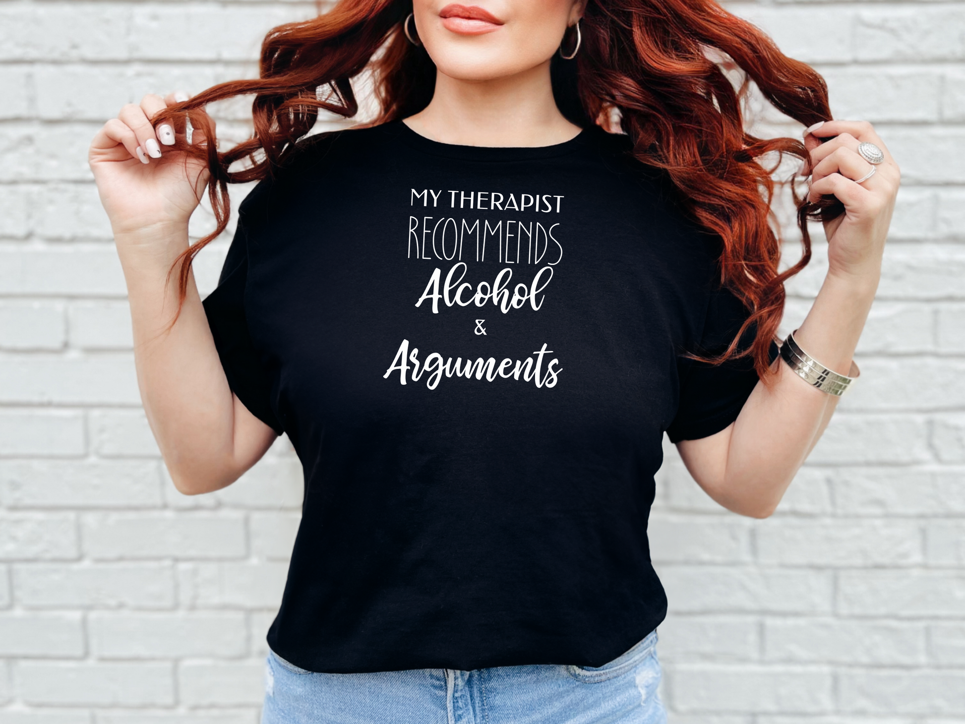 a woman wearing a black t - shirt with the words my therapiest