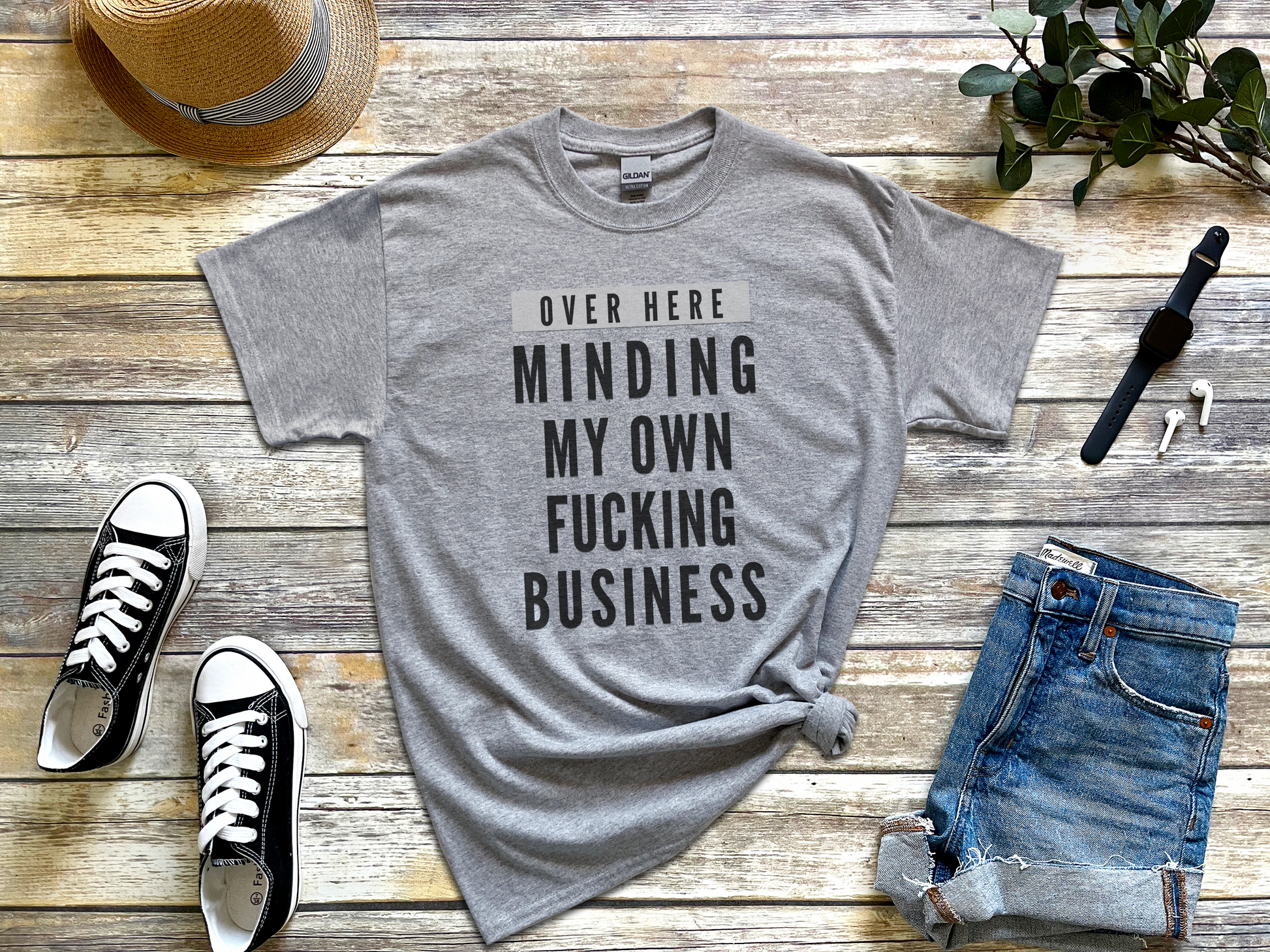 a t - shirt that says, over here minding my own fucking business