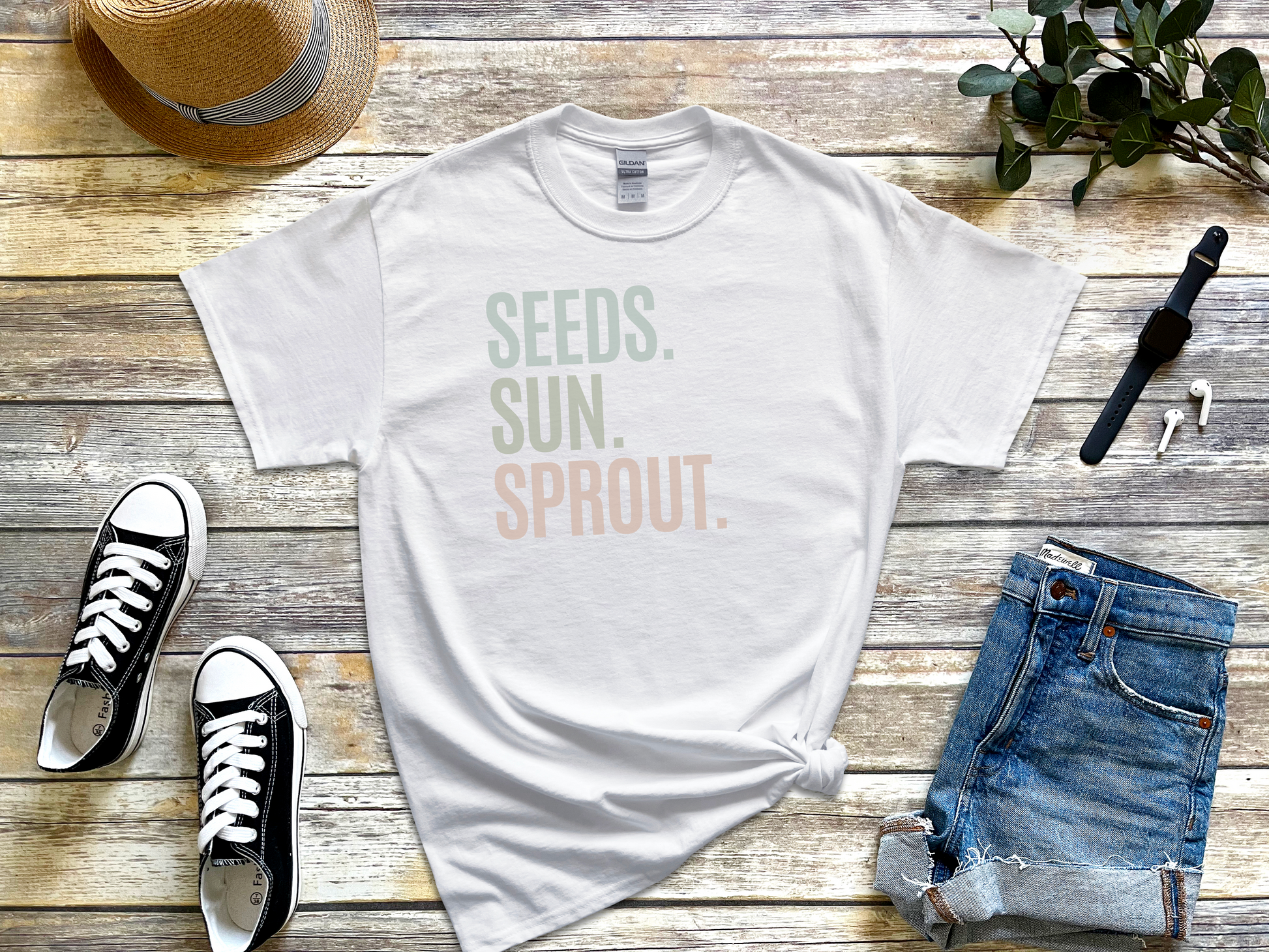 a t - shirt that says seeds, sun, sprout on it