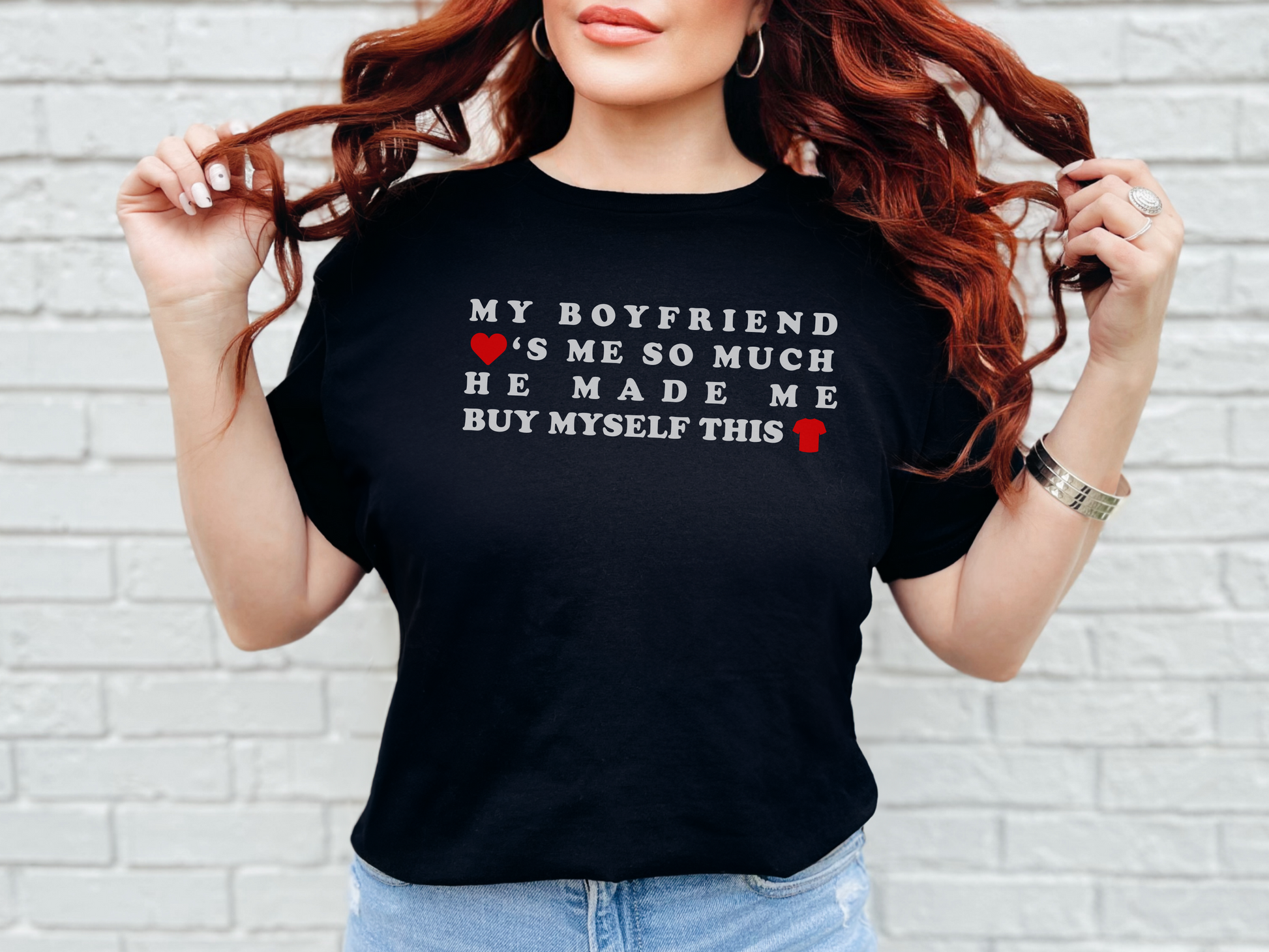 a woman with red hair wearing a black shirt that says my boyfriend is so much