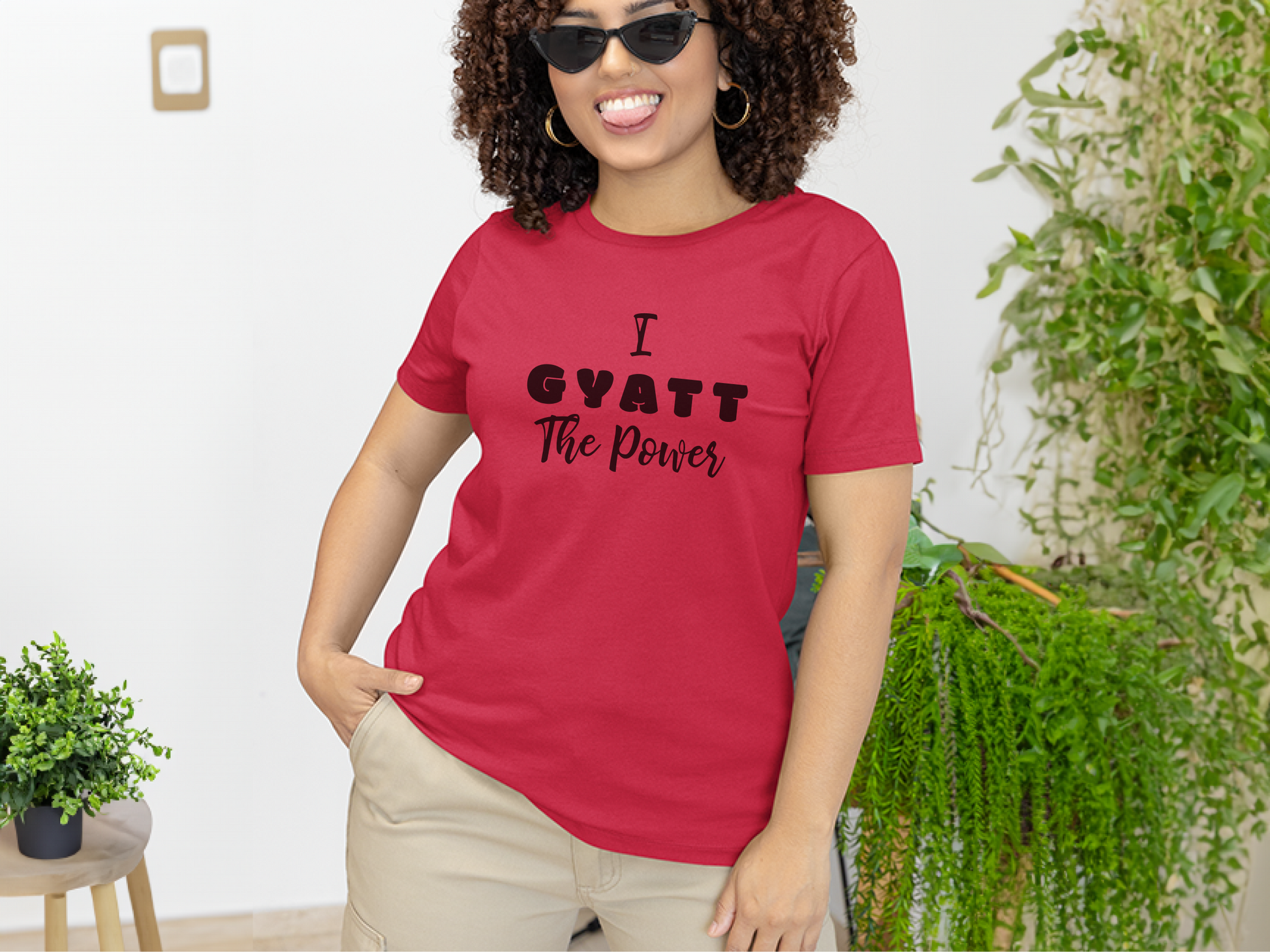 a woman wearing a red t - shirt that says i want the power