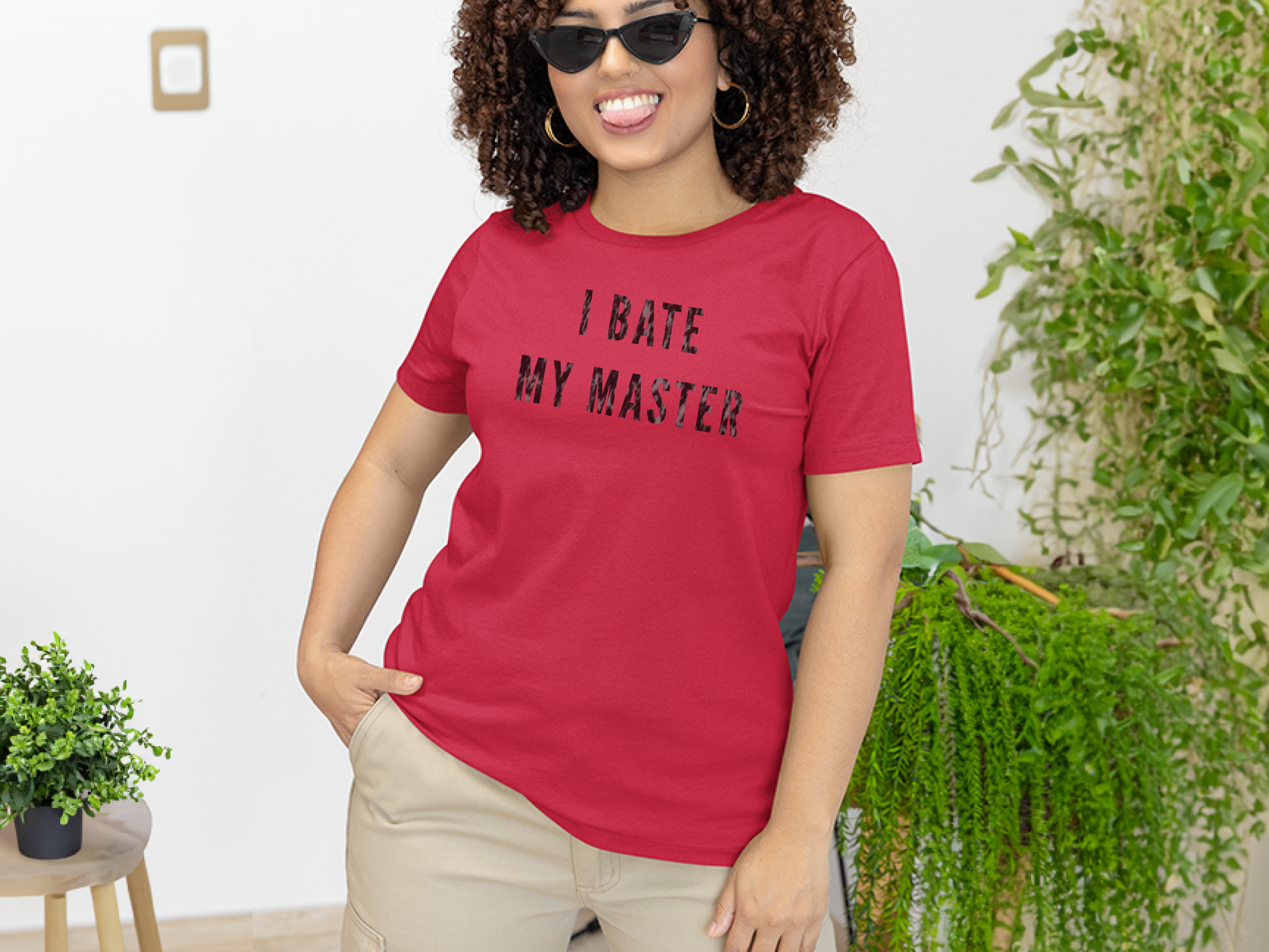 a woman wearing a red shirt that says i hate my master