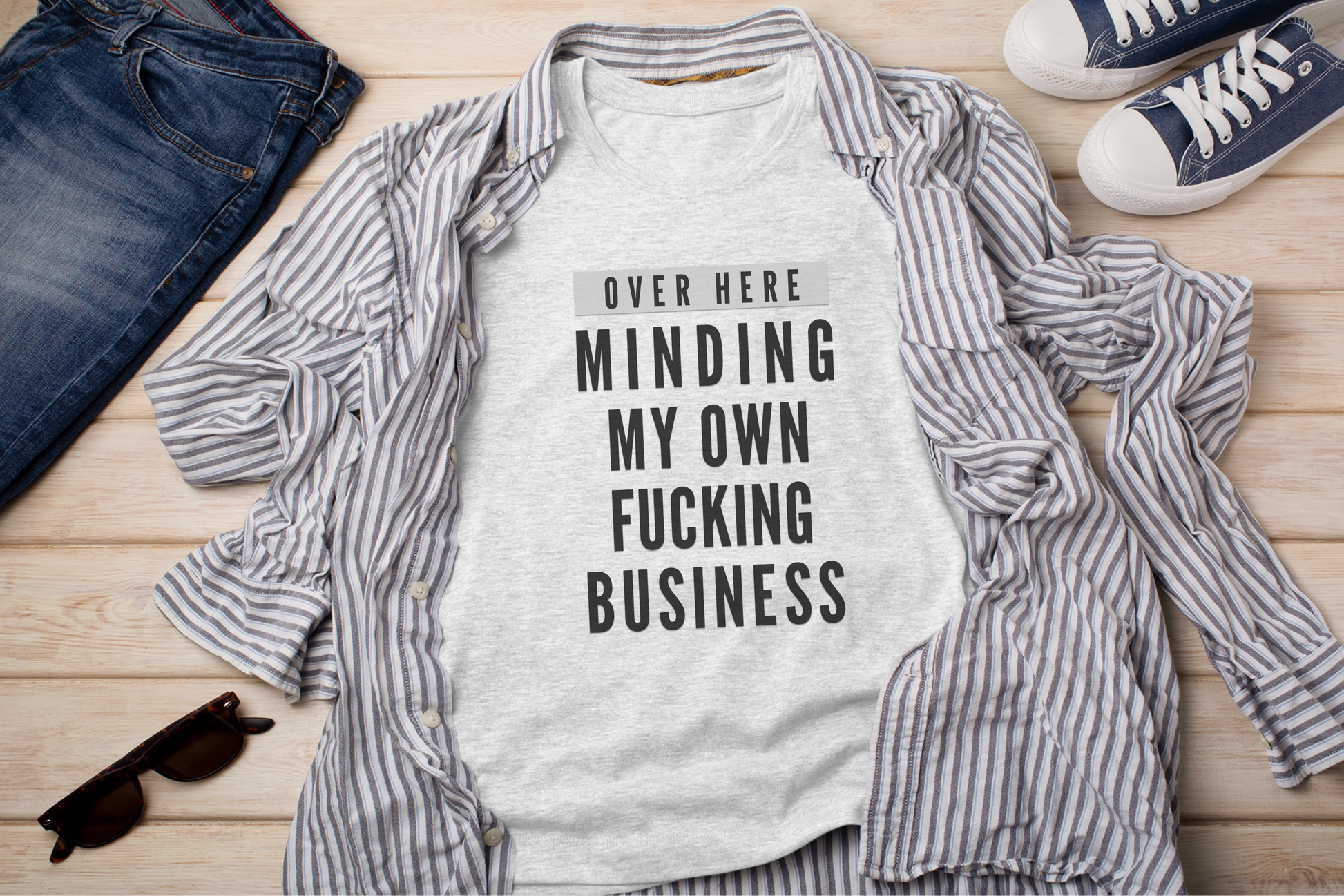 a t - shirt that says, over here, minding my own fucking business