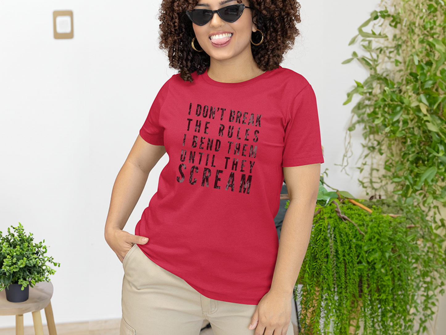 a woman wearing a red t - shirt that says i don't break the