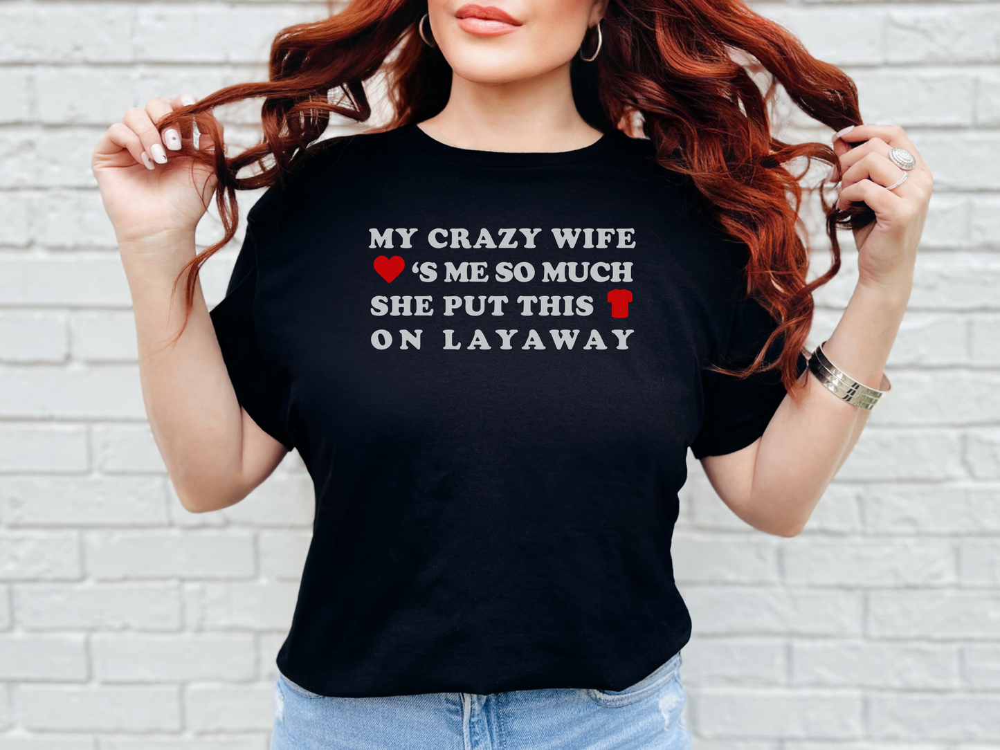 a woman wearing a black t - shirt that says, my crazy wife is so