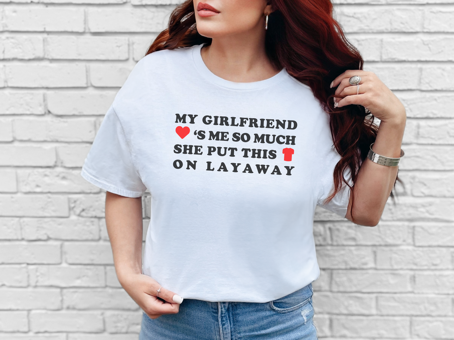 a woman wearing a t - shirt that says my girlfriend is so much she put