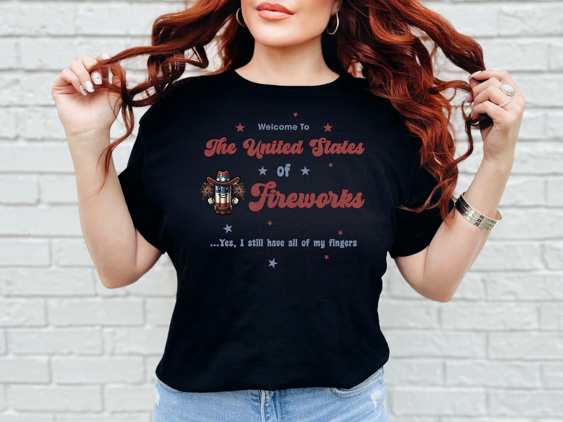 a woman wearing a black t - shirt with the words the united states of fireworks