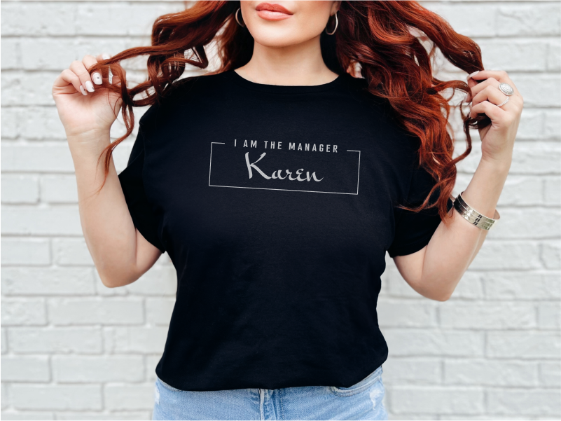 a woman with red hair wearing a black t - shirt