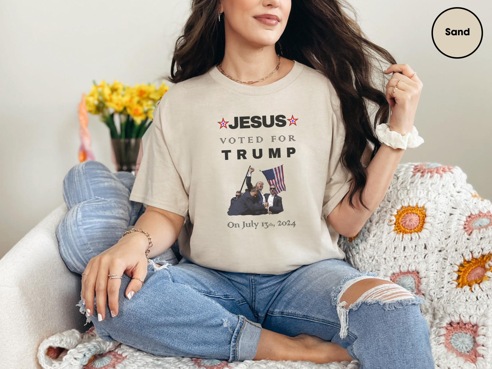 a woman sitting on a couch wearing a jesus vote for trump t - shirt